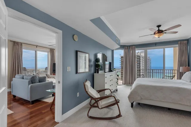 a bedroom with a balcony a bed and a couch