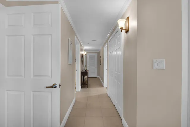 a bedroom with two beds and a chandelier