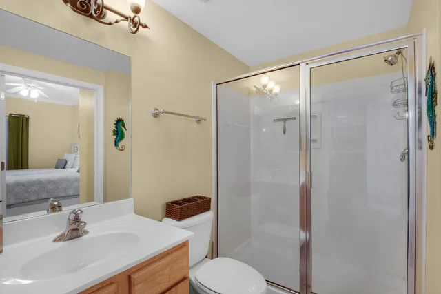 a bedroom with a large bed and a large window