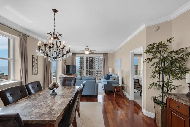 a view of a dining room with furniture window and wooden floor