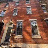 a building view with a brick wall
