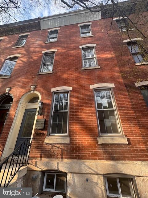 a building view with a brick wall
