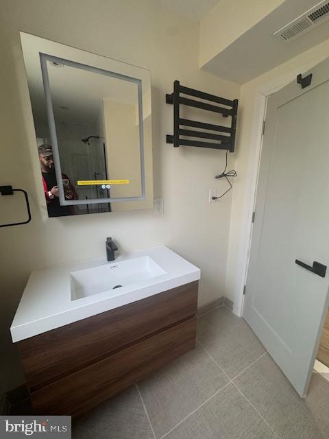 1809 Christian Street Philadelphia, PA 19146 - Photo 11 of 20 a bathroom with a sink and a mirror