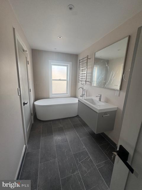 1809 Christian Street Philadelphia, PA 19146 - Photo 12 of 20 a bathroom with a sink a toilet and tub
