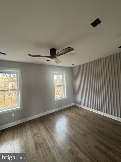 1809 Christian Street Philadelphia, PA 19146 - Photo 9 of 20 an empty room with wooden floor and windows