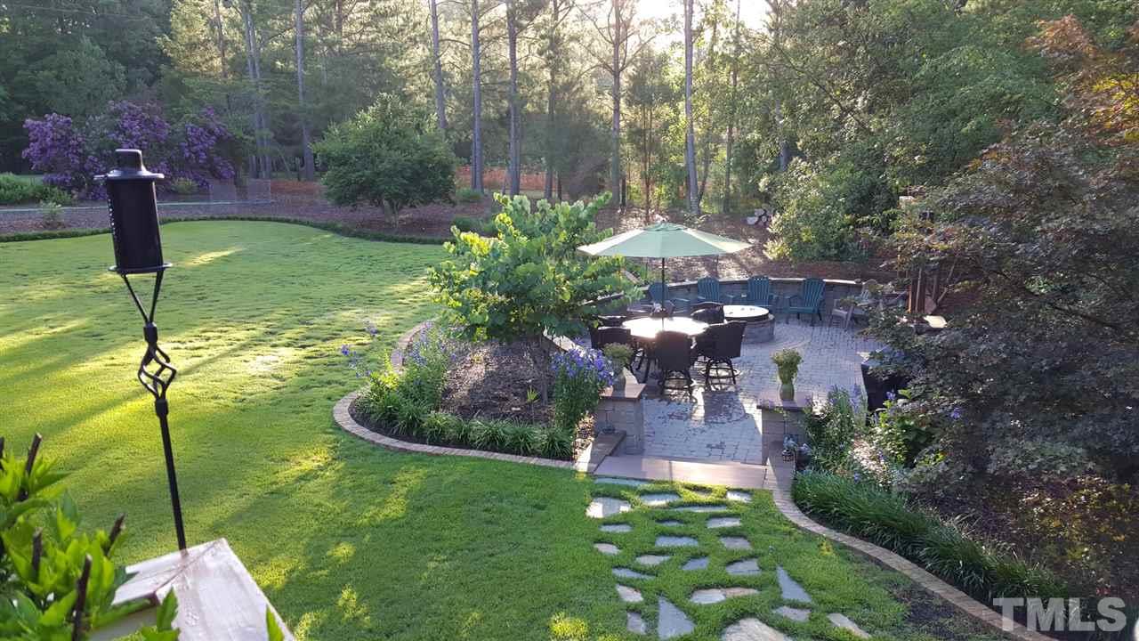 2708 Alloway Court Raleigh, NC 27606 - Photo 3 of 29 Patio with firepit, built-in grill and swing. Relax or entertain.