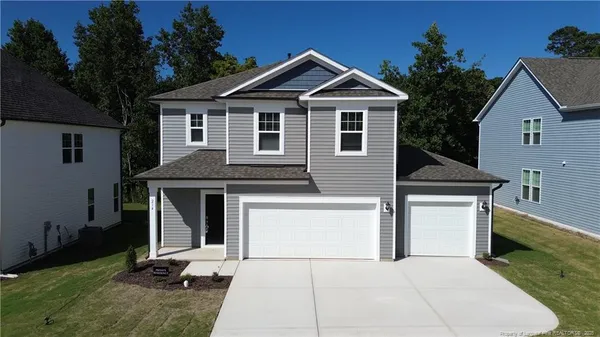 a front view of a house with a garage