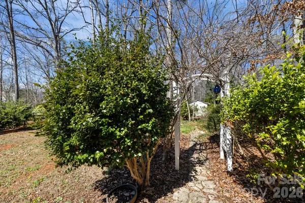 a backyard of a house with lots of green space