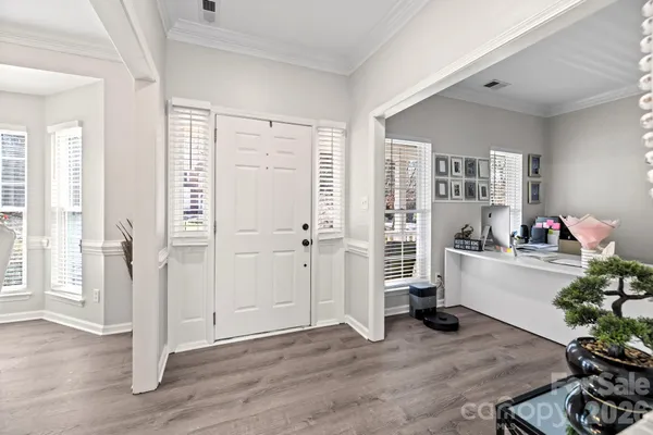 a view of a living room and a wooden floor