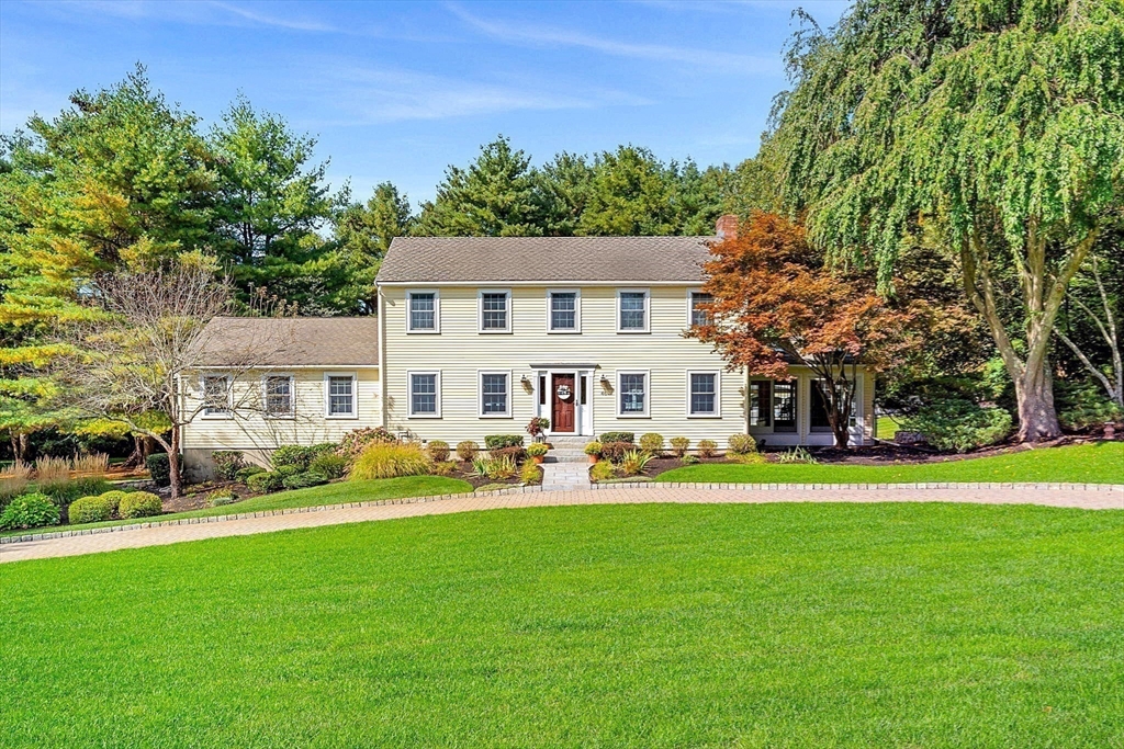 46 Wilmor Road Topsfield, MA 01983 - Photo 3 of 41 a front view of a house with a garden and trees