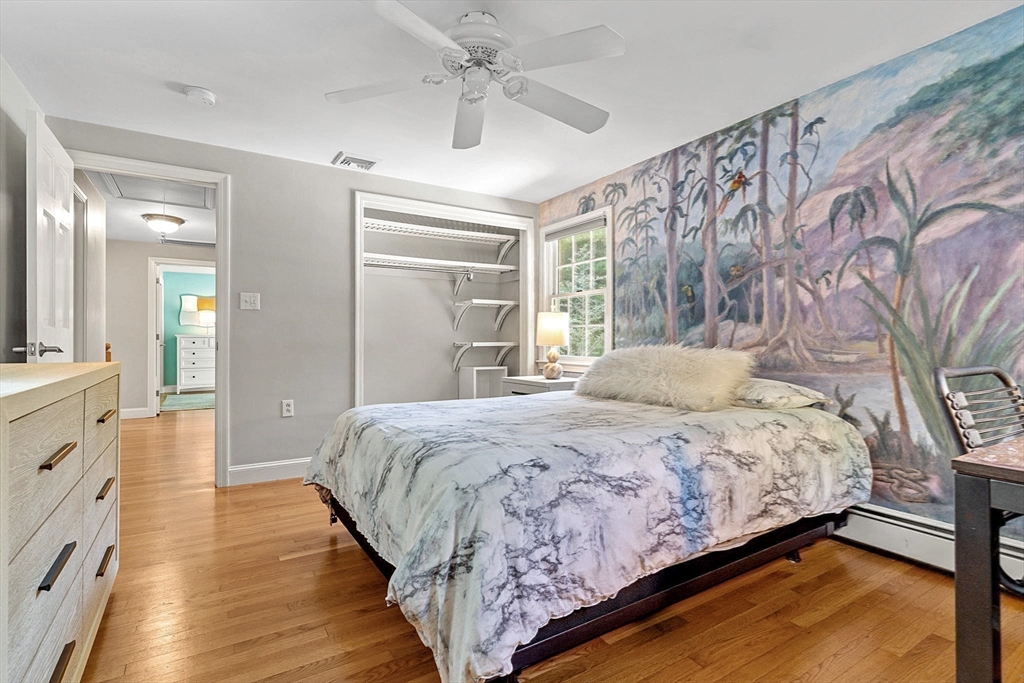 46 Wilmor Road Topsfield, MA 01983 - Photo 34 of 41 a bedroom with a large bed and a chandelier