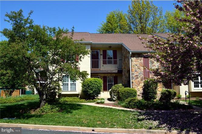142 Valley Stream Circle Chesterbrook, PA 19087 - Photo 1 of 15 a front view of a house with a yard