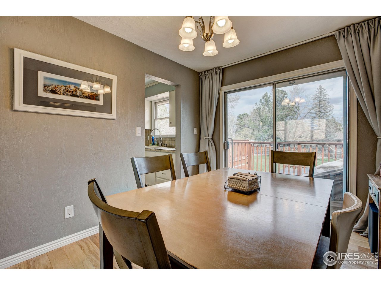 1912 Homestead Road Greeley, CO 80634 - Photo 16 of 40 Dining room with sliding door to massive deck