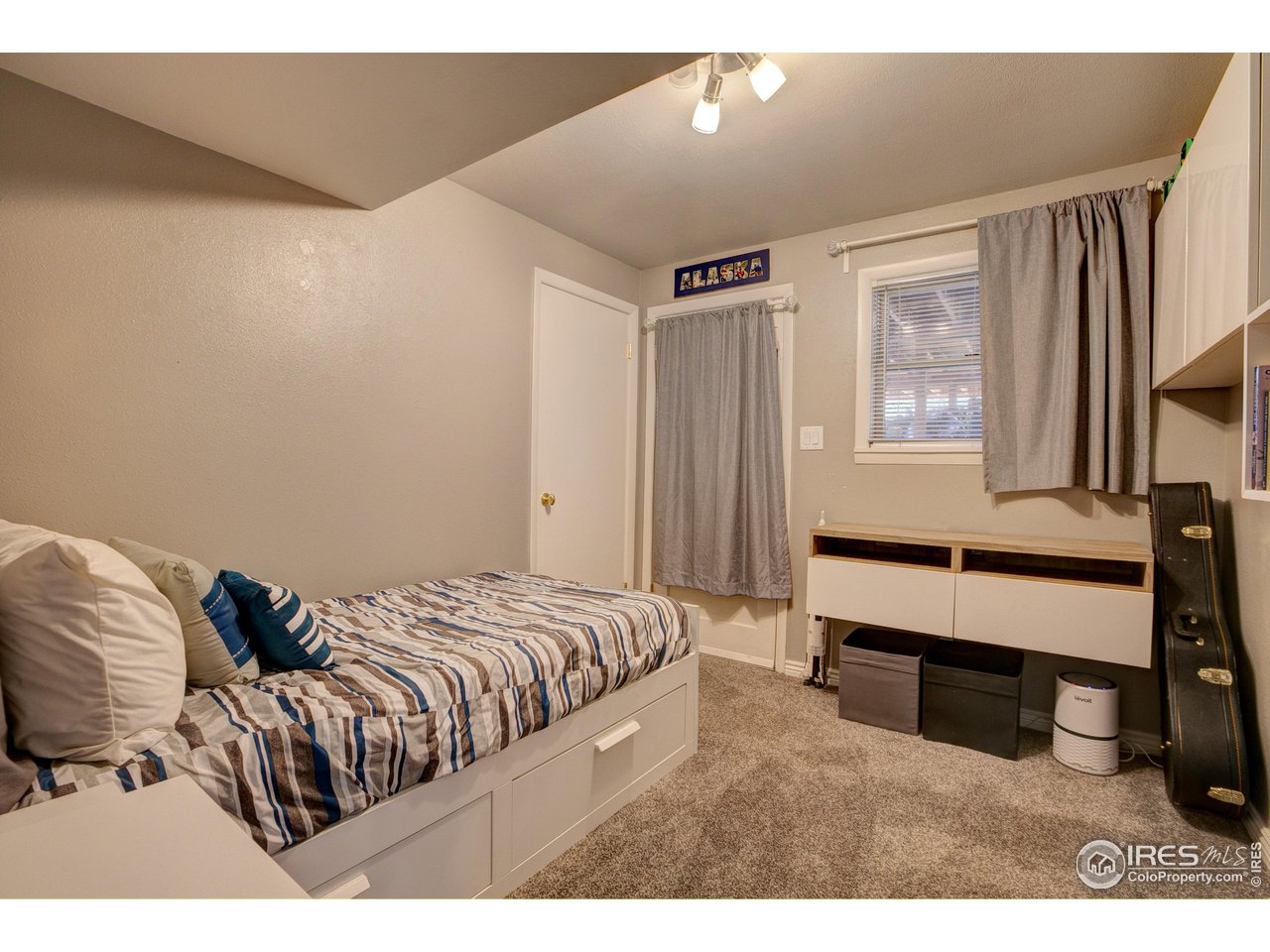 1912 Homestead Road Greeley, CO 80634 - Photo 28 of 40 Lower Level Bedroom 3 with door to the back yard!