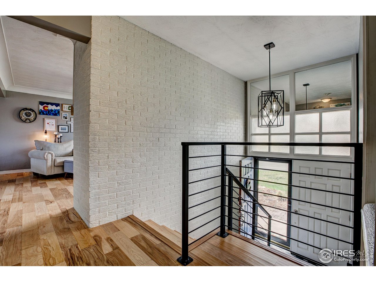 Wood flooring on the upper level, view to living room