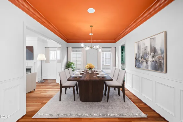 a dining room with furniture and wooden floor