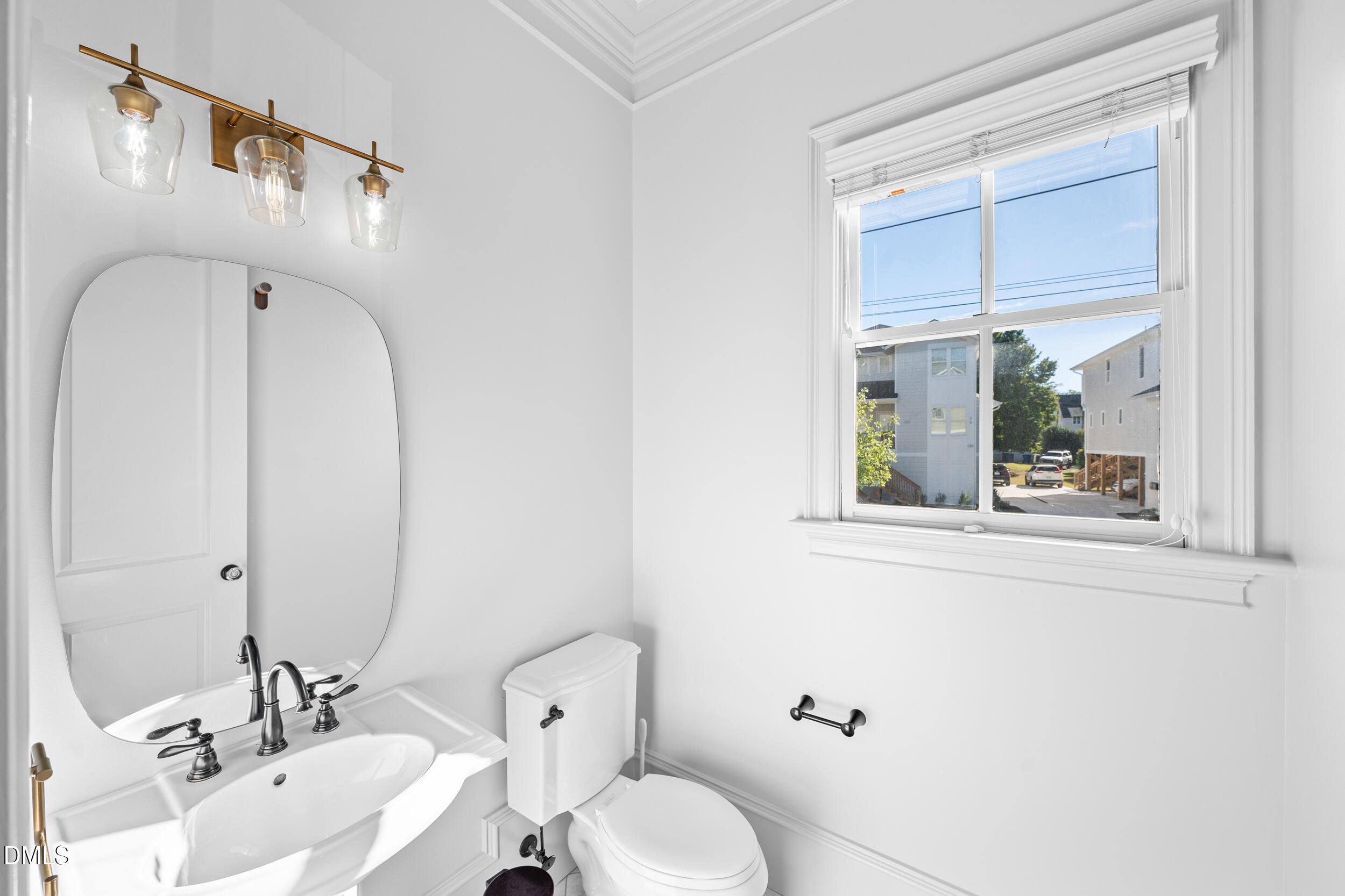 3100 Raymond Street Raleigh, NC 27607 - Photo 14 of 50 a bathroom with a sink and mirror with toilet