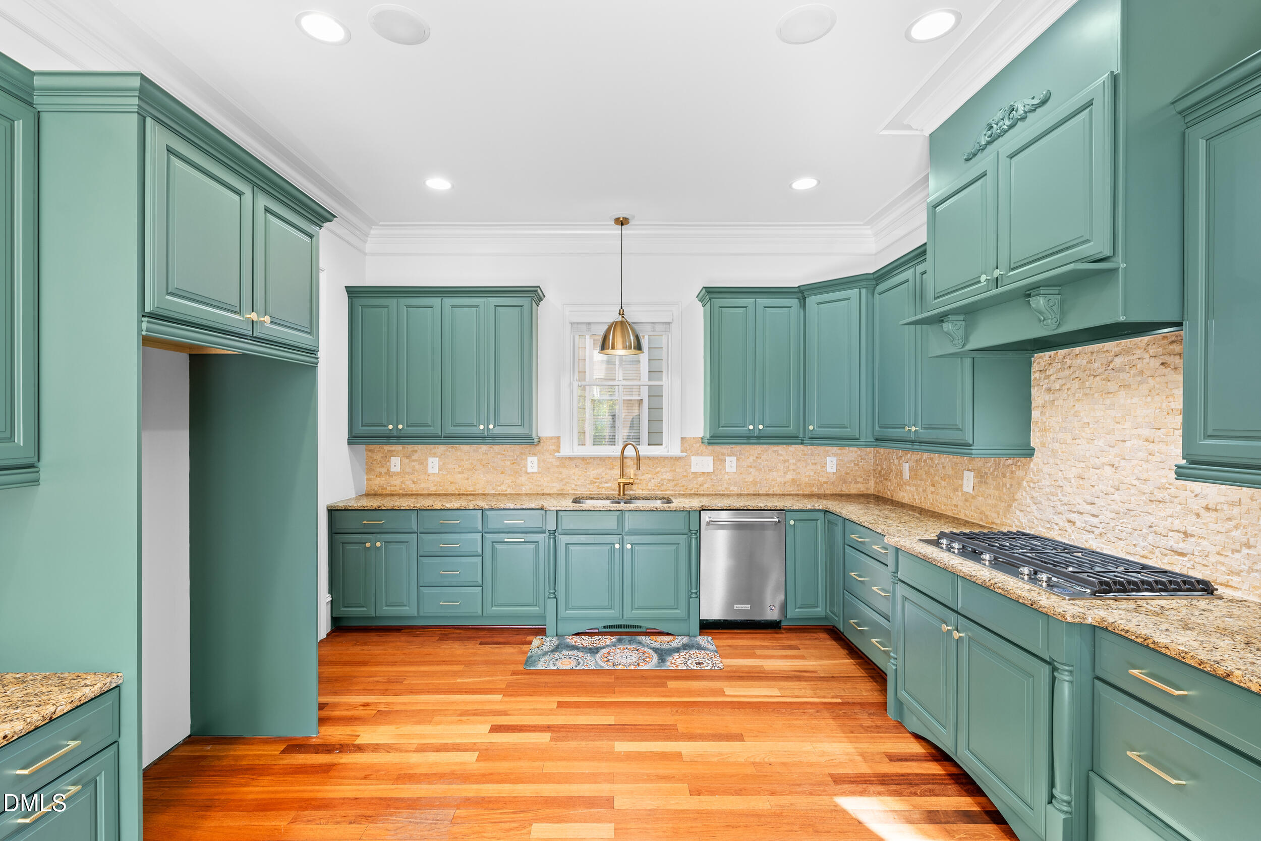 3100 Raymond Street Raleigh, NC 27607 - Photo 15 of 50 a kitchen with stainless steel appliances granite countertop a sink and cabinets