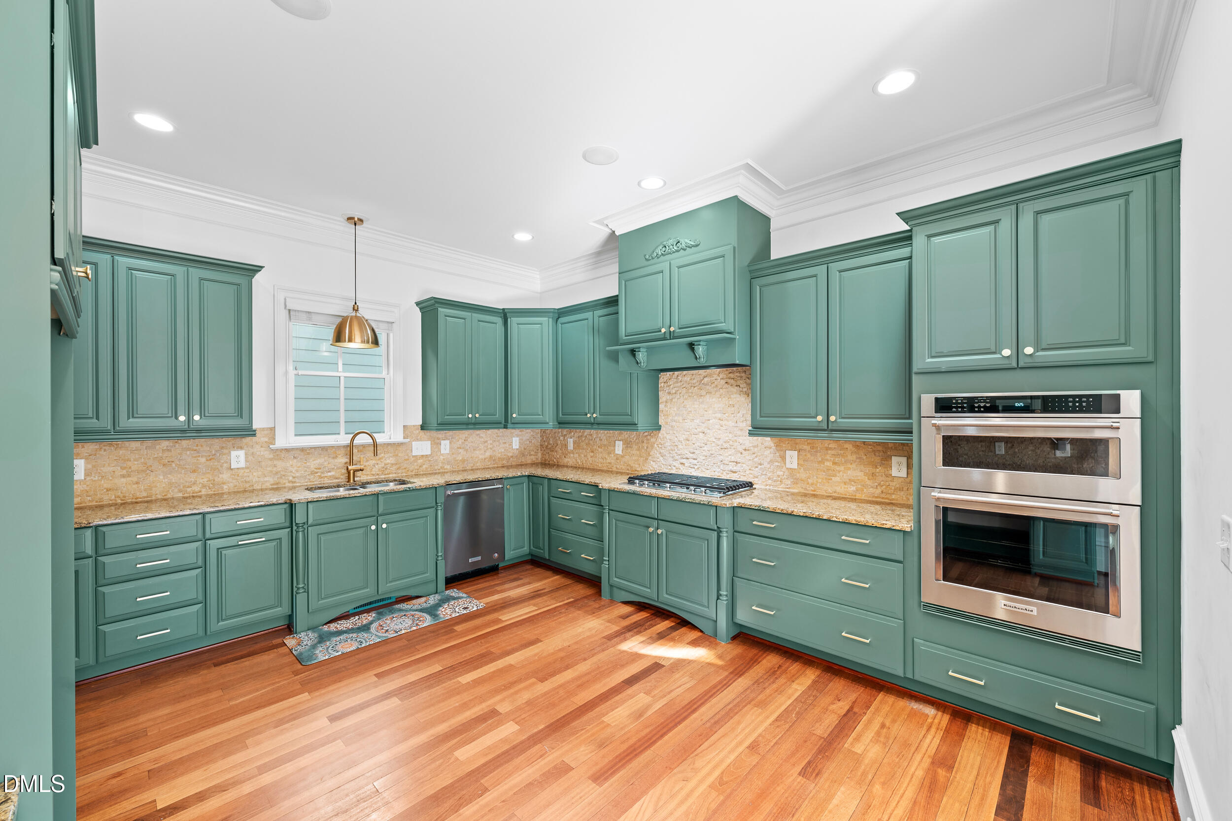 3100 Raymond Street Raleigh, NC 27607 - Photo 16 of 50 a kitchen with lots of counter top space sink and a stove