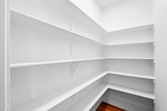 a view of an empty walk in closet