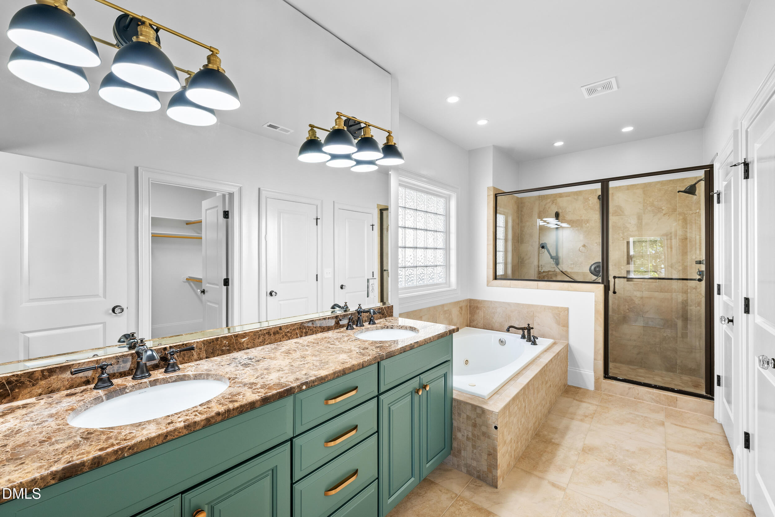 3100 Raymond Street Raleigh, NC 27607 - Photo 28 of 50 a bathroom with a sink double vanity and a mirror