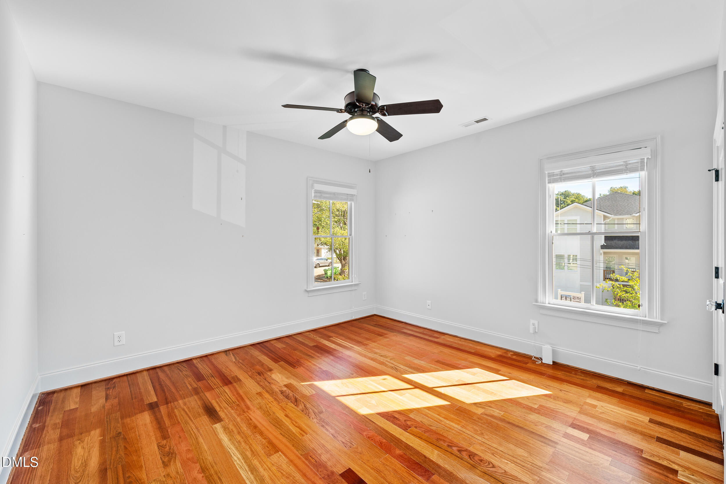 3100 Raymond Street Raleigh, NC 27607 - Photo 33 of 50 wooden floor in an empty room with a window