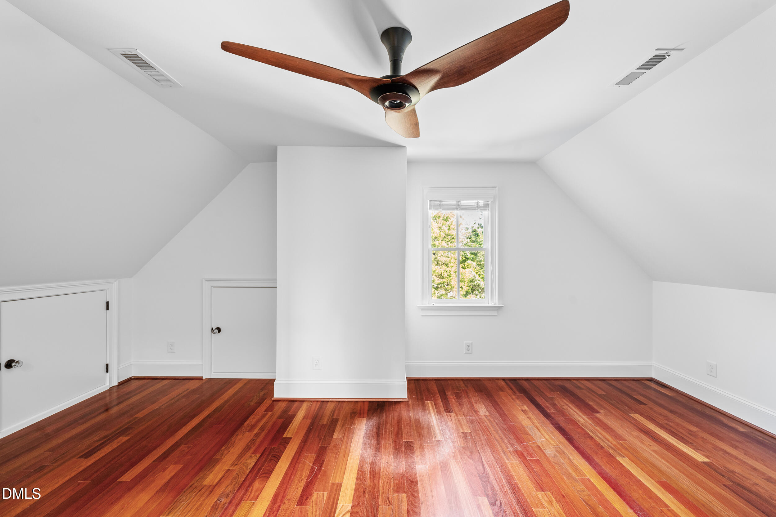 3100 Raymond Street Raleigh, NC 27607 - Photo 40 of 50 a view of empty room with wooden floor and fan