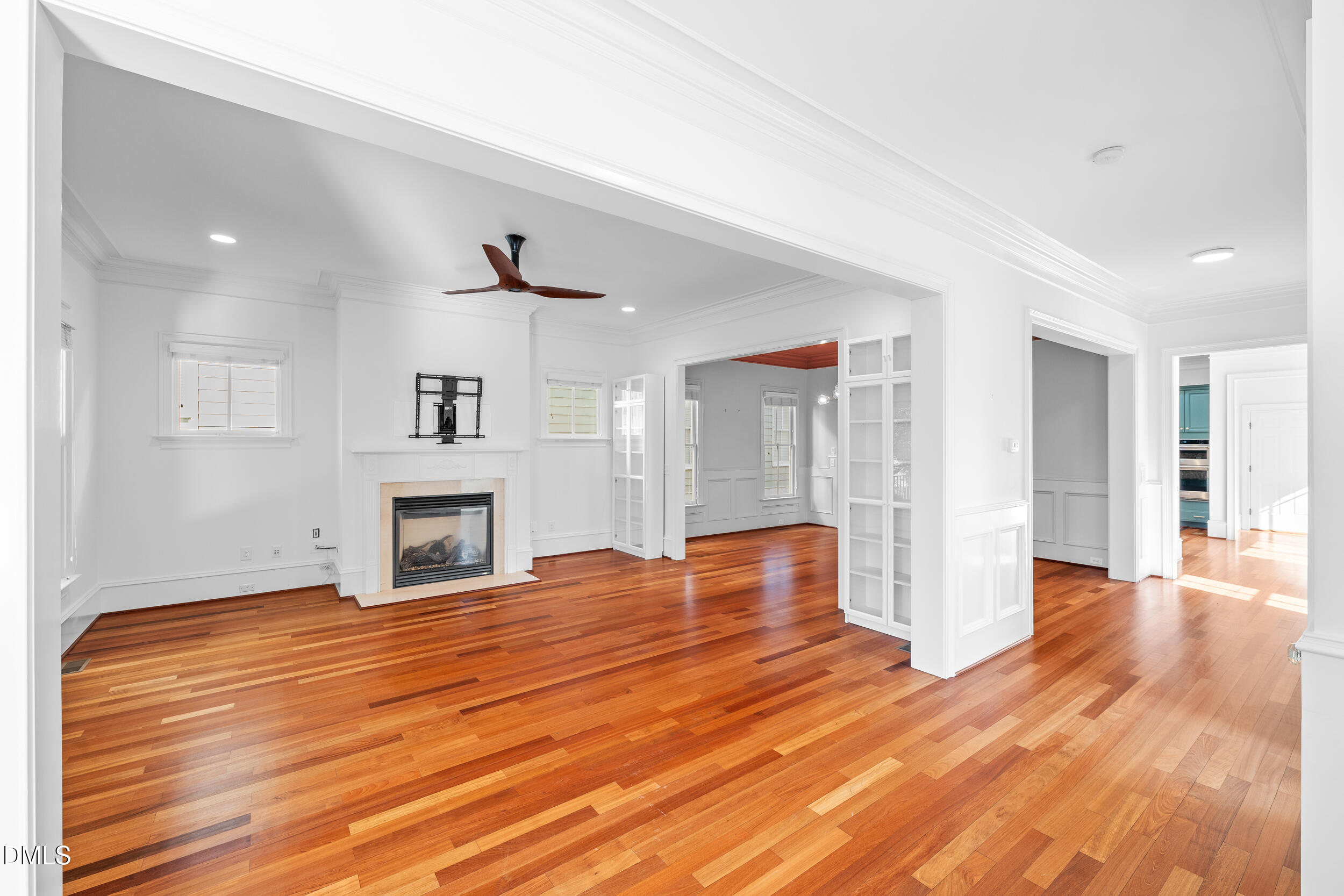 3100 Raymond Street Raleigh, NC 27607 - Photo 6 of 50 a view of empty room with wooden floor and fireplace