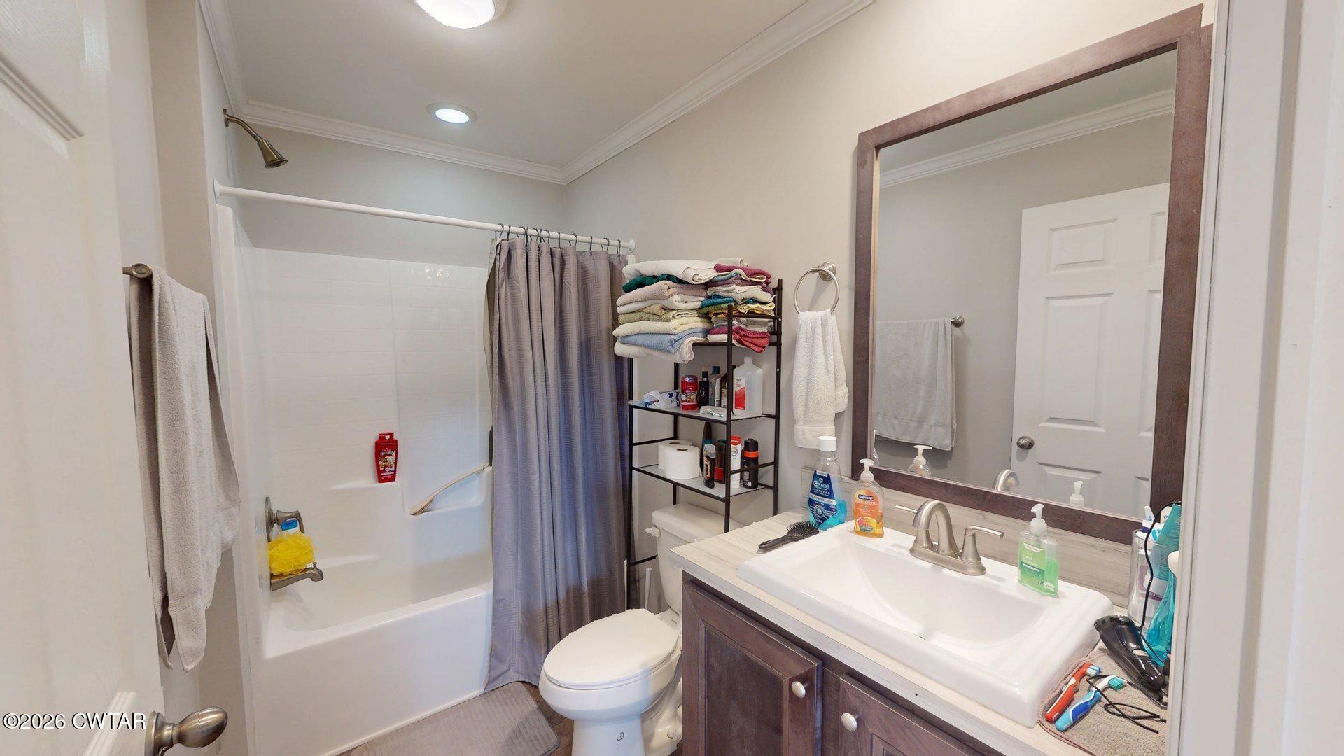 193 Wagner Street Trimble, TN 38259 - Photo 13 of 15 a bathroom with a sink vanity mirror and toilet