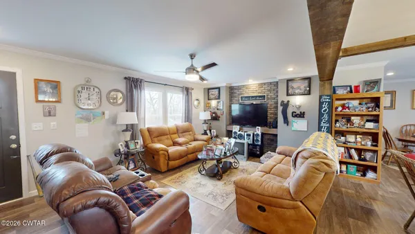 a living room with furniture or couch and a flat screen tv