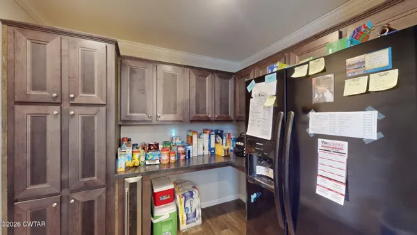 a room with refrigerator and window