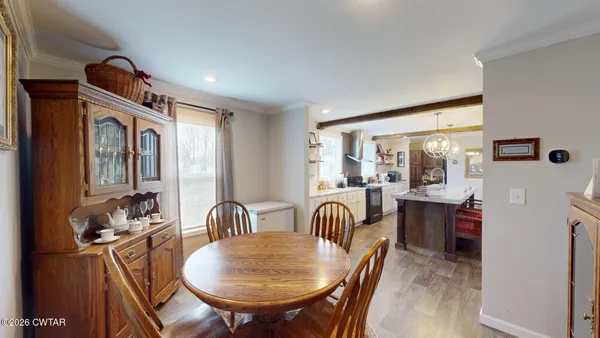 a dining room with furniture and window