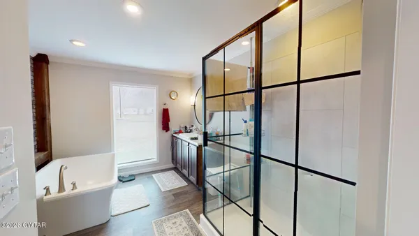 a bathroom with a tub and shower