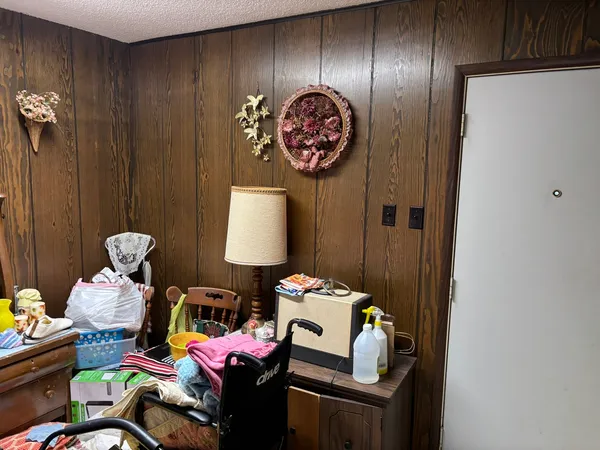 a bedroom with furniture and a window