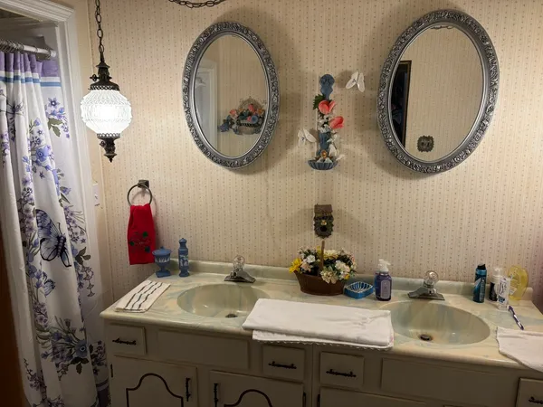 a bathroom with a sink and a mirror