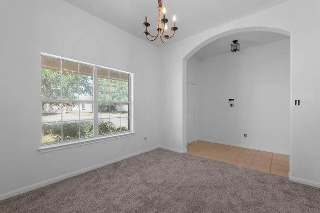 a view of room with window and ceiling fan
