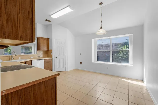 a view of kitchen with furniture and window