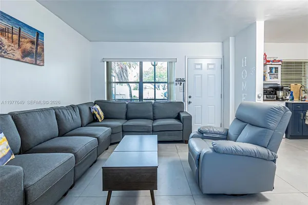 a living room with furniture and a window