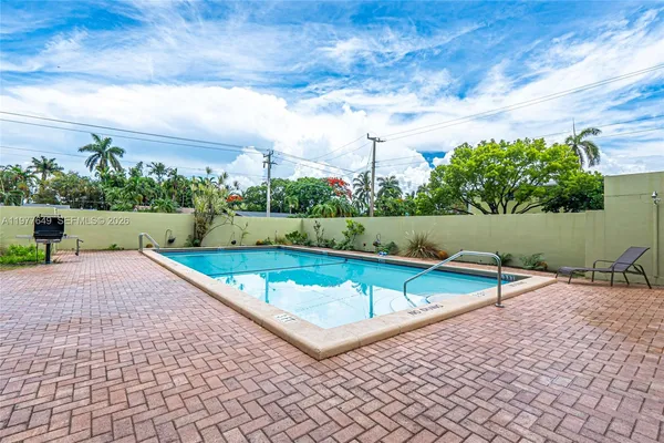 swimming pool view with a outdoor space