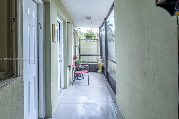 a backyard of a house with outdoor seating and windows