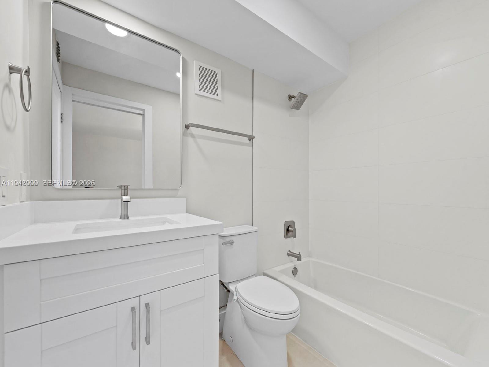 10825 Southwest 112th Avenue, Unit 206 Miami, FL 33176 - Photo 13 of 32 a bathroom with a sink a toilet and shower