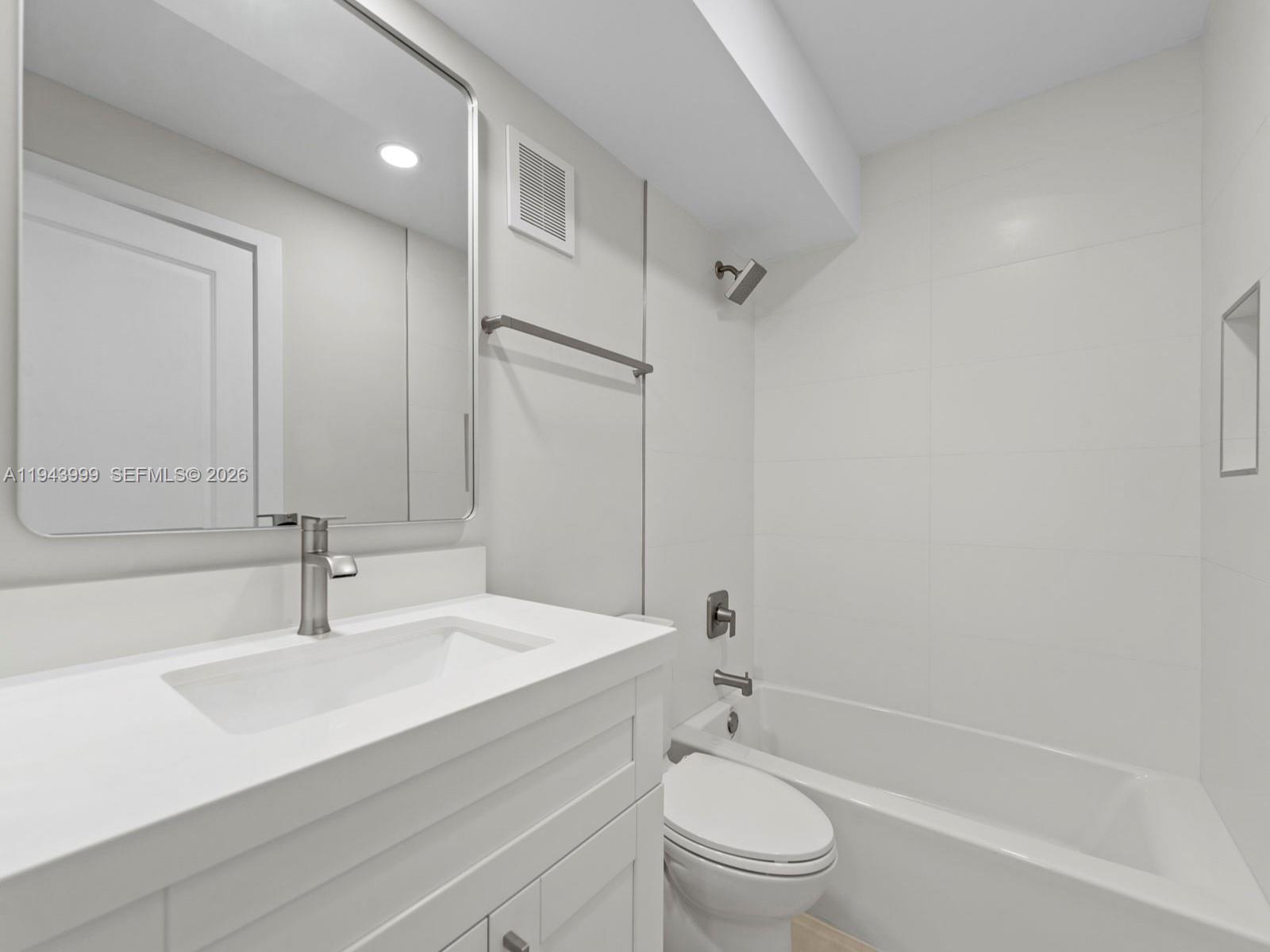 10825 Southwest 112th Avenue, Unit 206 Miami, FL 33176 - Photo 14 of 32 a bathroom with a sink a toilet and a bathtub