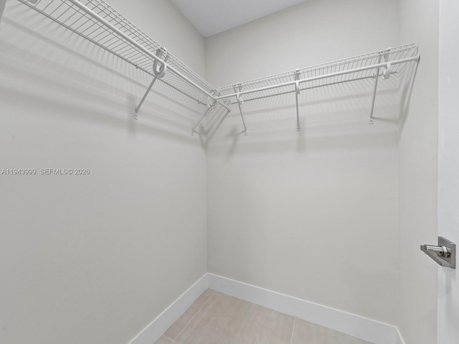 10825 Southwest 112th Avenue, Unit 206 Miami, FL 33176 - Photo 18 of 32 a view of a room with racks on the wall