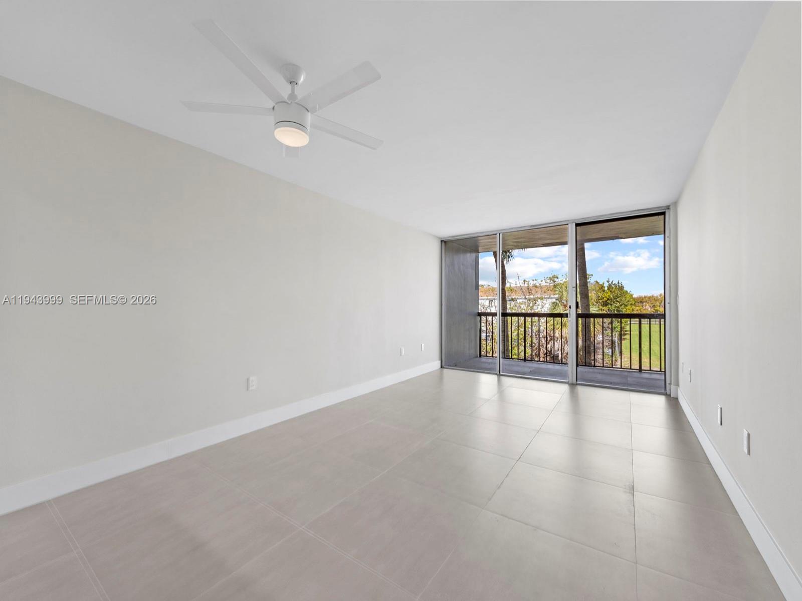 10825 Southwest 112th Avenue, Unit 206 Miami, FL 33176 - Photo 6 of 32 wooden floor in an empty room with a window