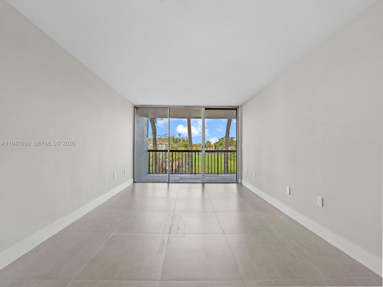 10825 Southwest 112th Avenue, Unit 206 Miami, FL 33176 - Photo 7 of 32 a view of an empty room with a window