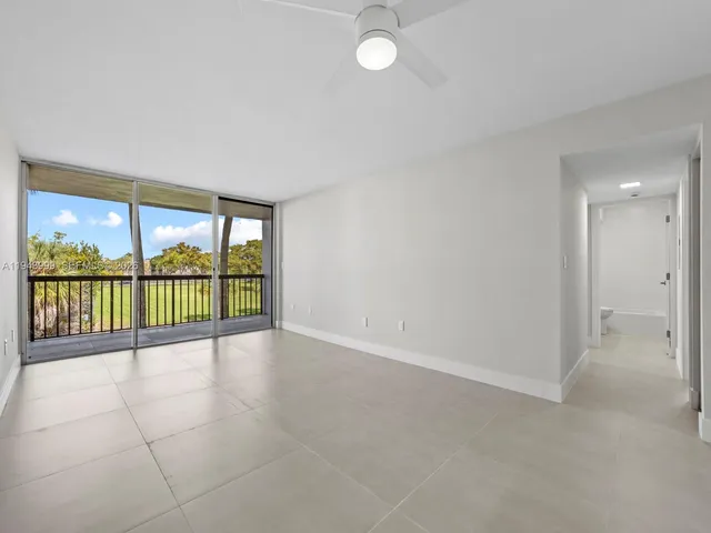 a view of an empty room with a large window