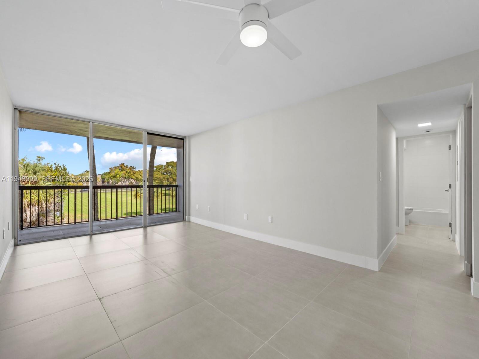 10825 Southwest 112th Avenue, Unit 206 Miami, FL 33176 - Photo 8 of 32 a view of an empty room with a large window