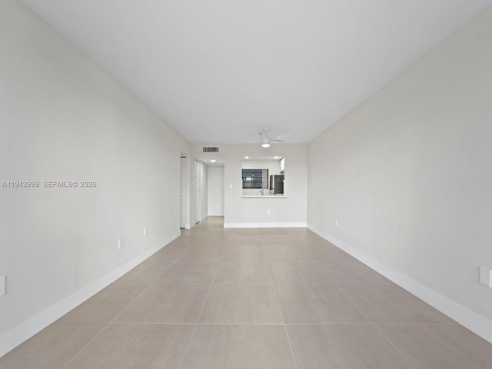 10825 Southwest 112th Avenue, Unit 206 Miami, FL 33176 - Photo 10 of 32 a view of an empty room with a window