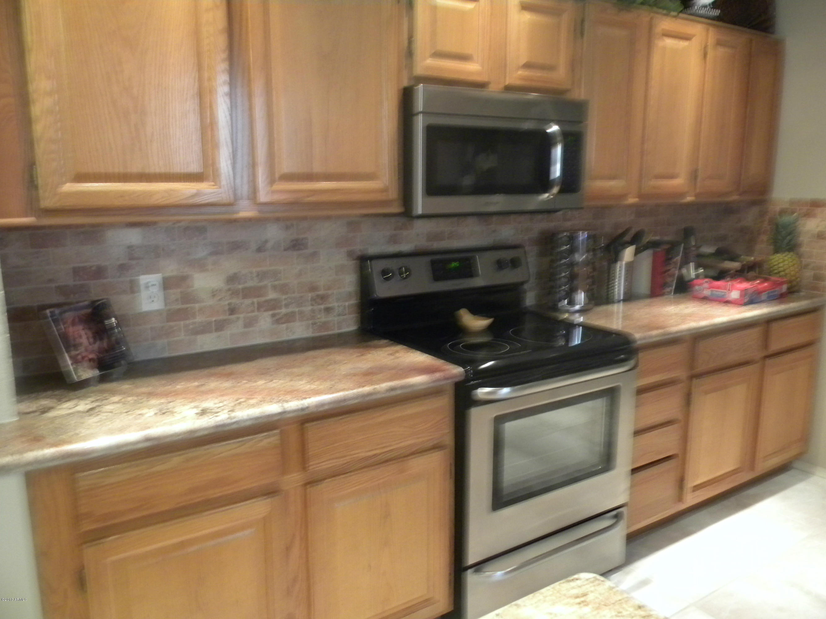 1326 East Mineral Road Gilbert, AZ 85234 - Photo 7 of 29 tile back splash / stainless appl.