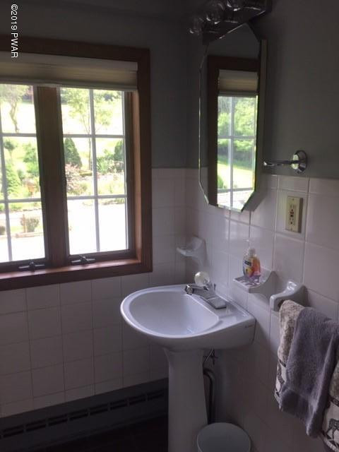 490 Tannery Road Lake Ariel, PA 18436 - Photo 28 of 46 a bathroom with a sink and a window